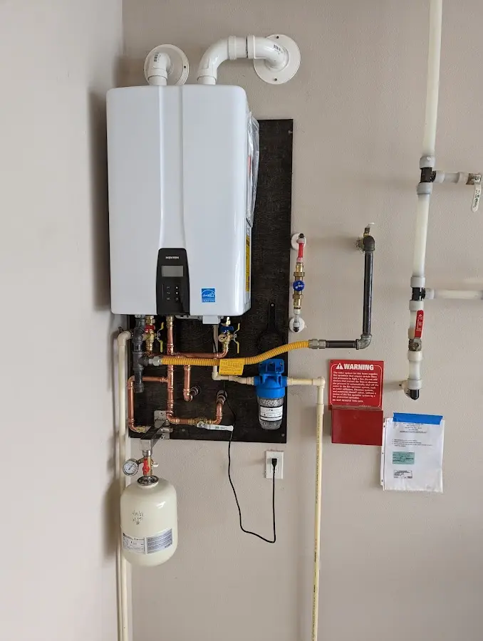 Professional plumber installing copper piping in a Kalifornsky home